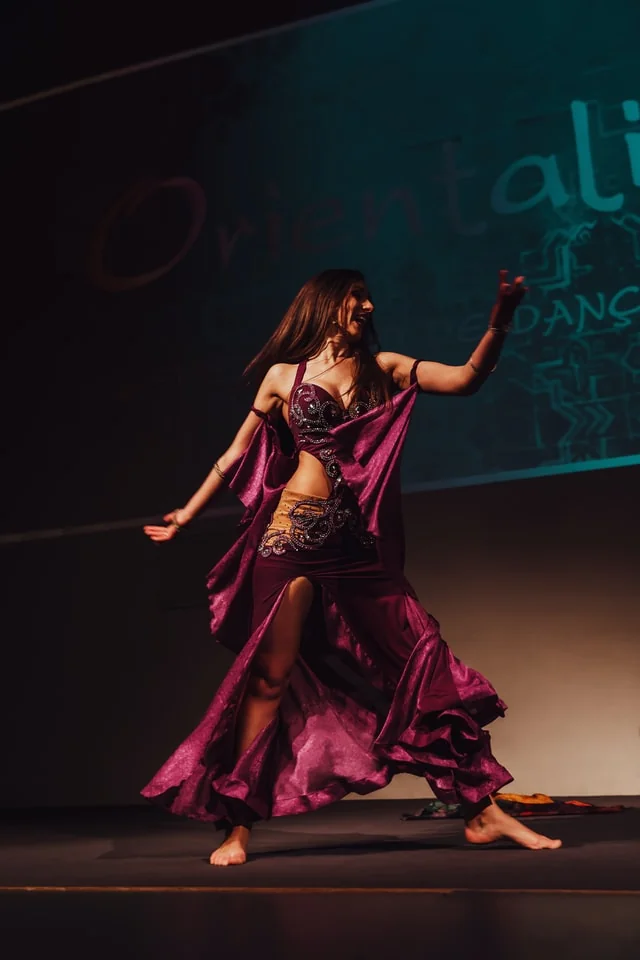 Bollywood class with arms raised mid-sequence