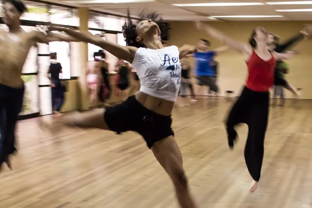 Adults learning a routine at a dance class