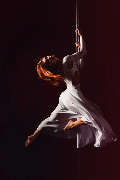 Beginner pole session in a studio with installed poles